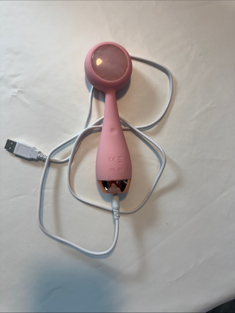 PMD Pink Facial Massager with Rose Gold Accent and White Cable